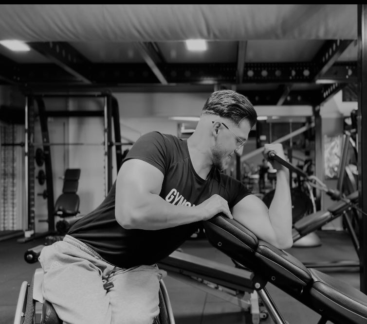 Joshua Mols training his arms in the gym from his wheelchair